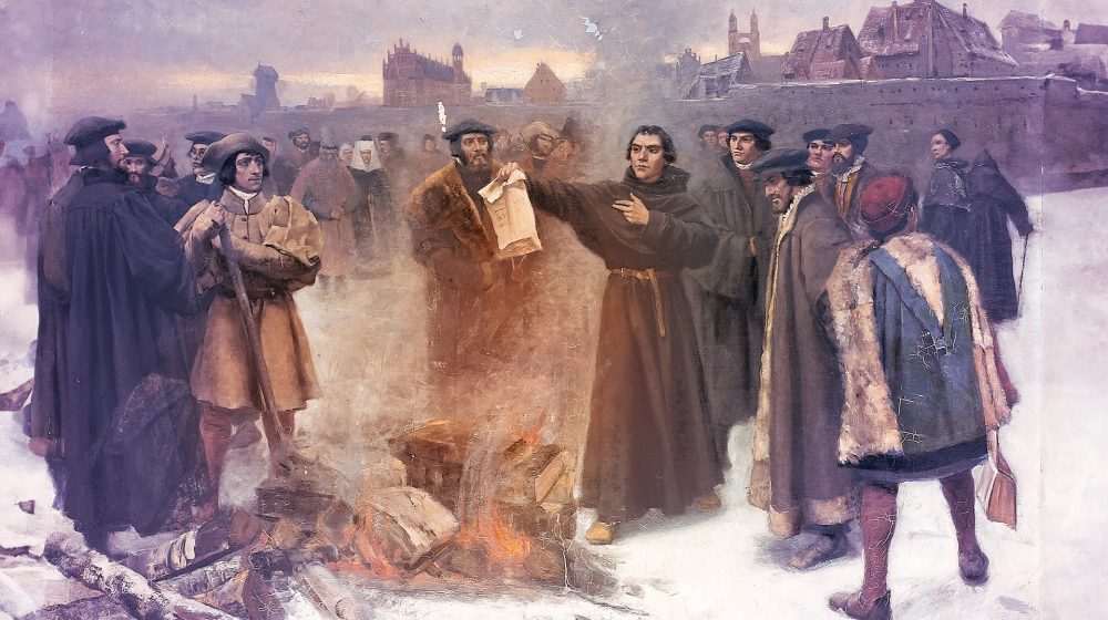 Luther burns the Papal bull in the square of Wittenberg year 1520