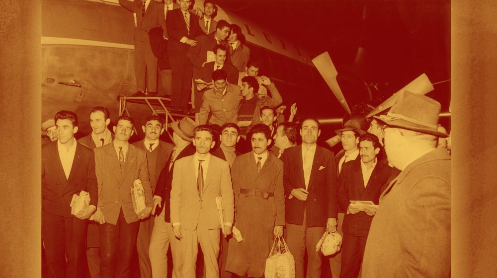 Historical photograph of the first Turkish guest workers arriving at Düsseldorf Airport in November 1961
