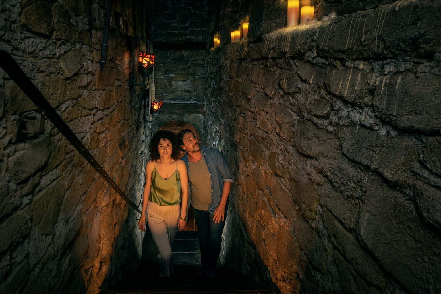 A couple walks up the stairs to the exhibition hall of the Deutschlandmuseum: The High Middle Ages