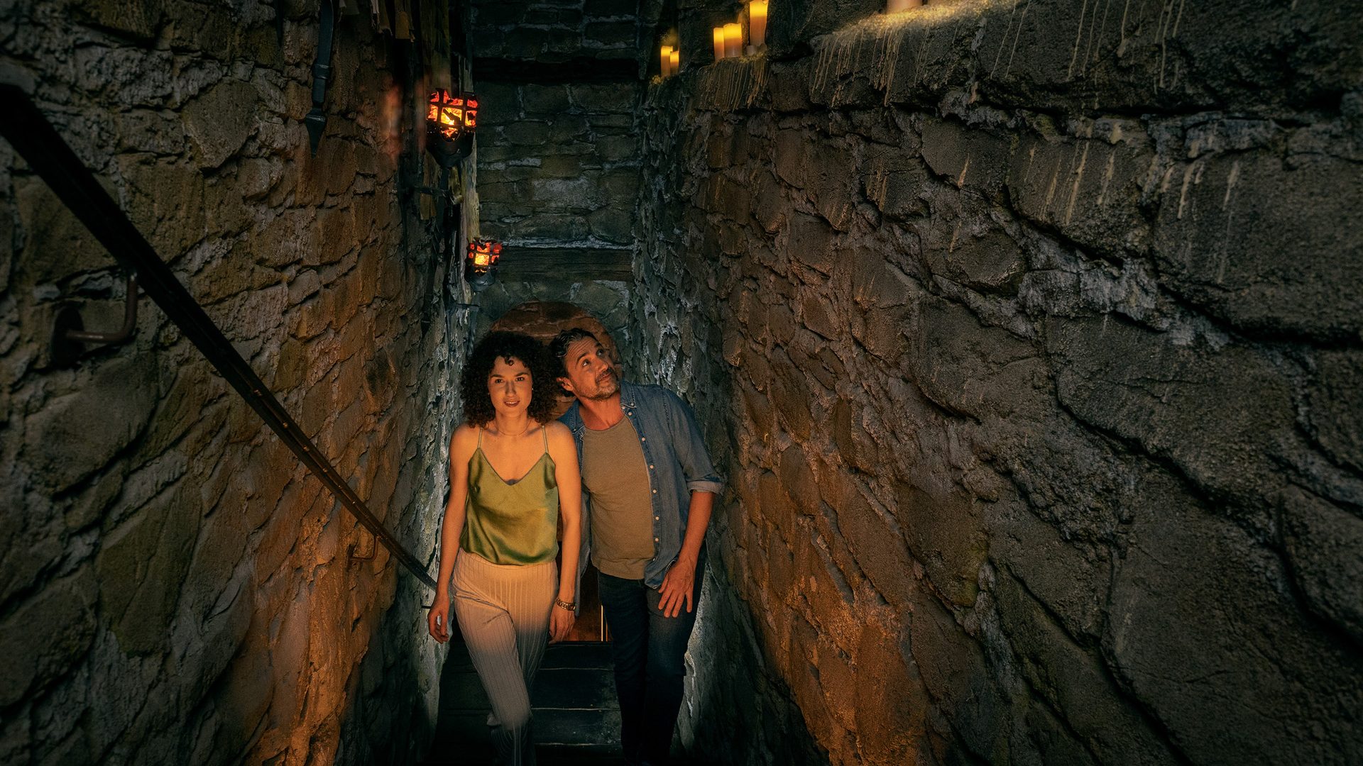 A couple walks up the stairs to the exhibition hall of the Deutschlandmuseum: The High Middle Ages