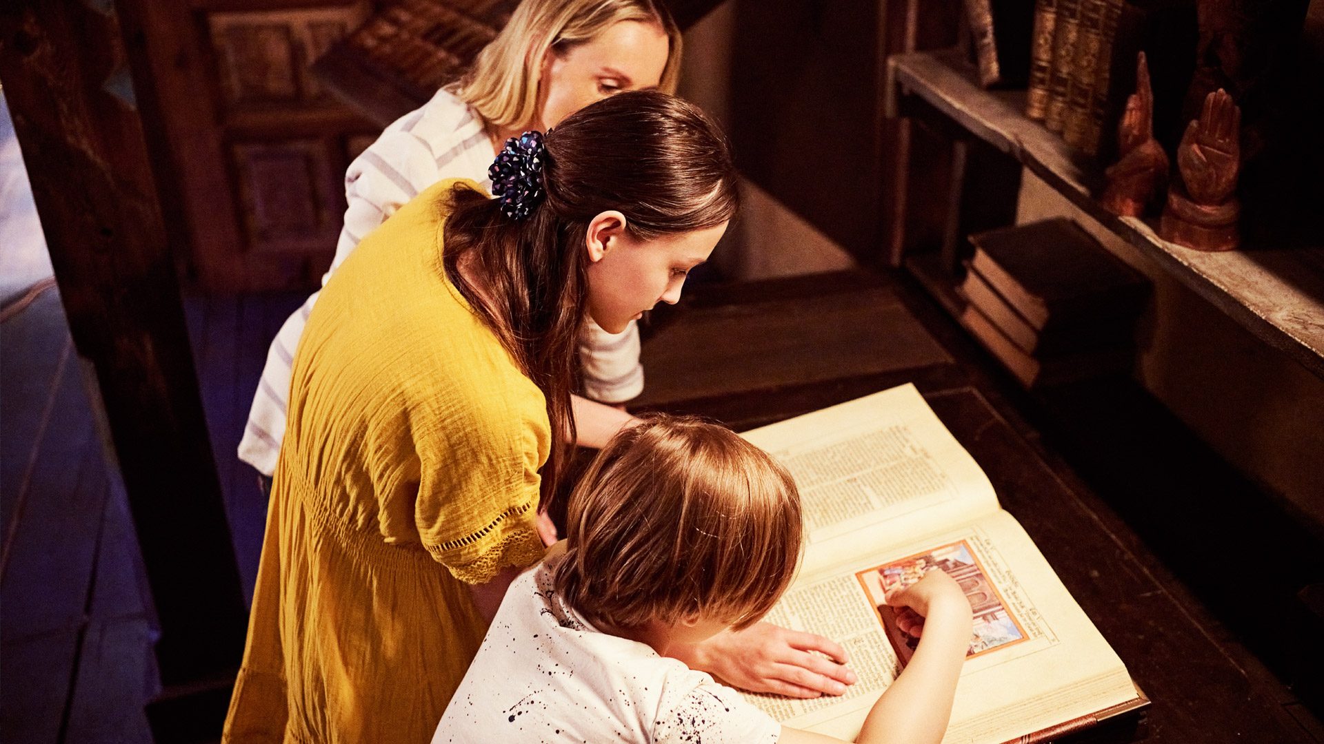 A group of all ages at the Deutschlandmuseum, trying their hand at letterpress printing